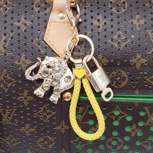 Authentic Louis Vuitton Lock & Key with unbranded Elephant Bagcharm, Keycharm